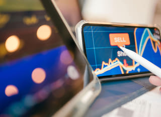 Trader across multiple markets assessing Bitcoin Ethereum and forex options
